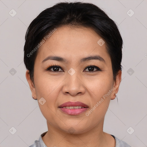 Joyful asian young-adult female with short  black hair and brown eyes