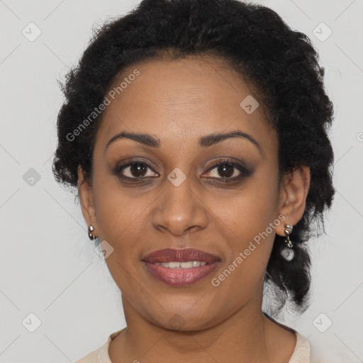 Joyful black adult female with short  brown hair and brown eyes