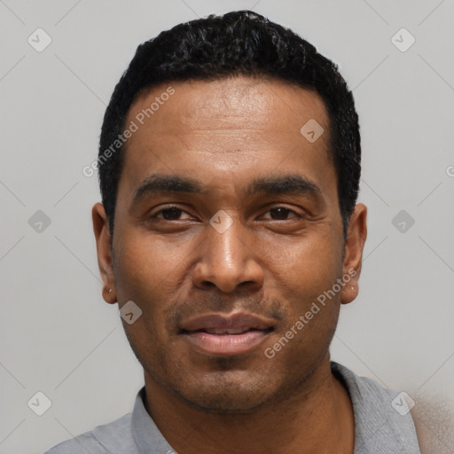 Joyful black young-adult male with short  black hair and brown eyes