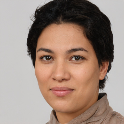 Joyful latino young-adult female with short  brown hair and brown eyes