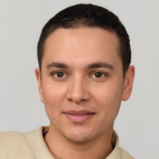 Joyful white young-adult male with short  brown hair and brown eyes