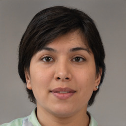 Joyful white young-adult female with medium  brown hair and brown eyes