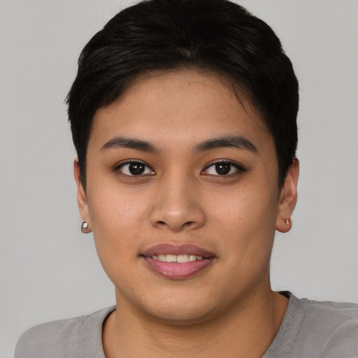 Joyful asian young-adult female with short  black hair and brown eyes