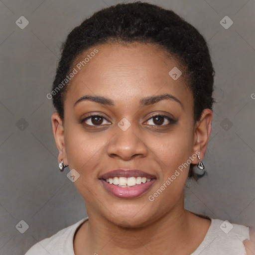 Joyful black young-adult female with short  brown hair and brown eyes