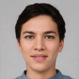 Joyful asian young-adult male with short  brown hair and brown eyes