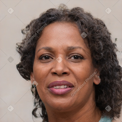 Joyful black adult female with medium  brown hair and brown eyes