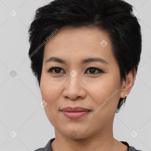 Joyful asian young-adult female with short  brown hair and brown eyes