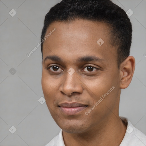 Joyful black young-adult male with short  black hair and brown eyes