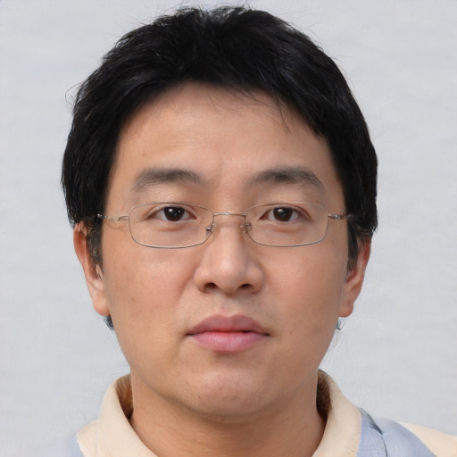 Neutral asian adult male with short  brown hair and brown eyes
