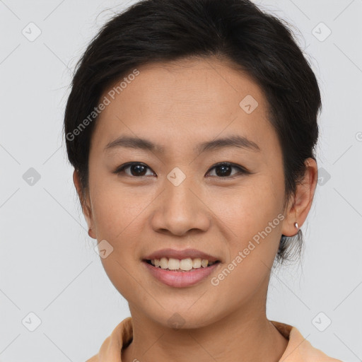 Joyful asian young-adult female with short  brown hair and brown eyes