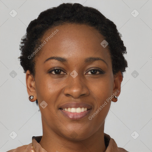 Joyful black young-adult female with short  brown hair and brown eyes