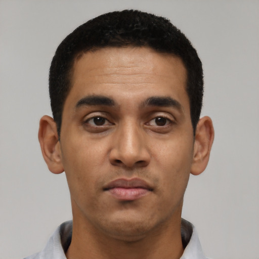 Neutral latino young-adult male with short  black hair and brown eyes