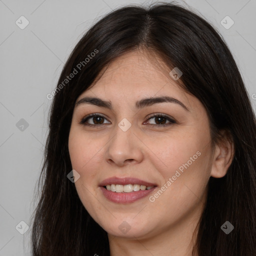 Joyful white young-adult female with long  brown hair and brown eyes