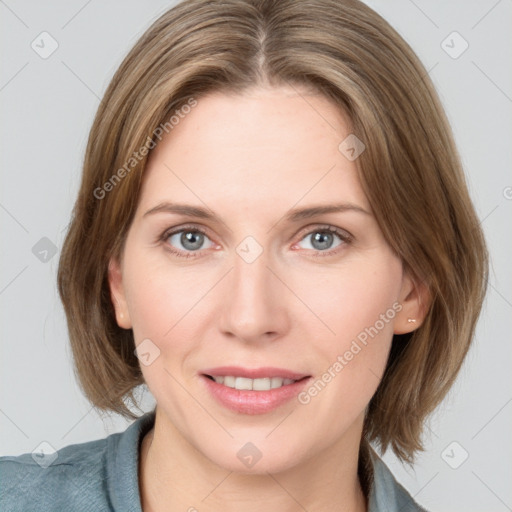 Joyful white young-adult female with medium  brown hair and blue eyes