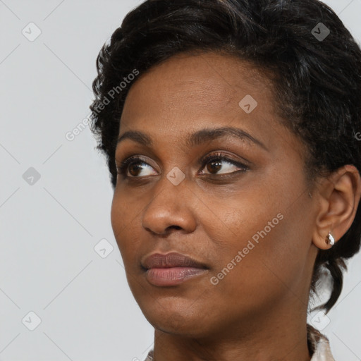 Neutral black young-adult female with short  black hair and brown eyes