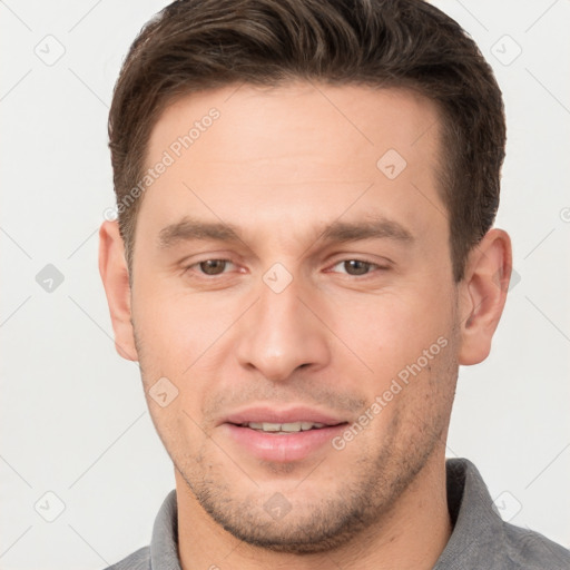 Joyful white young-adult male with short  brown hair and brown eyes