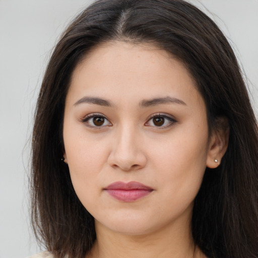 Joyful white young-adult female with long  brown hair and brown eyes