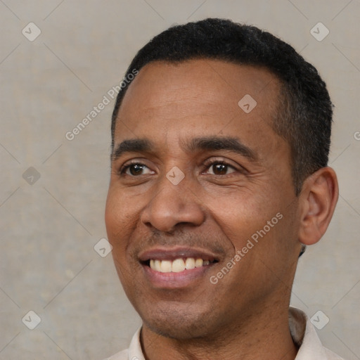 Joyful black adult male with short  black hair and brown eyes