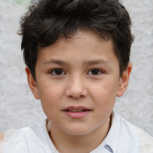 Joyful white child male with short  brown hair and brown eyes