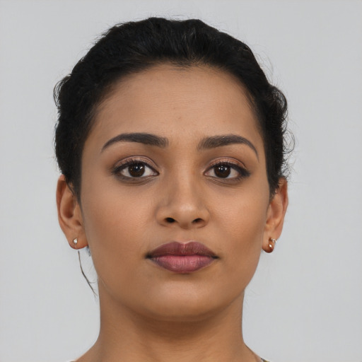 Neutral latino young-adult female with short  brown hair and brown eyes