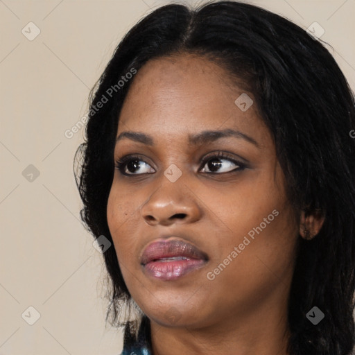 Joyful black young-adult female with long  black hair and brown eyes