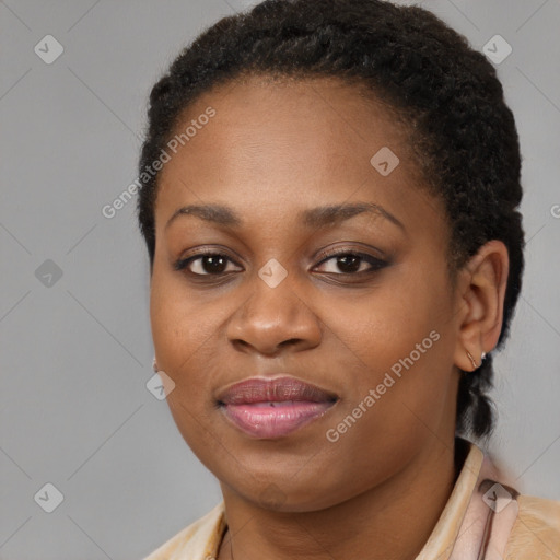 Joyful black young-adult female with short  brown hair and brown eyes