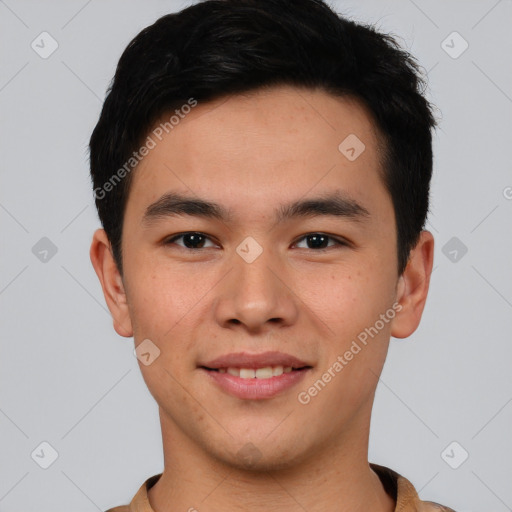 Joyful asian young-adult male with short  brown hair and brown eyes