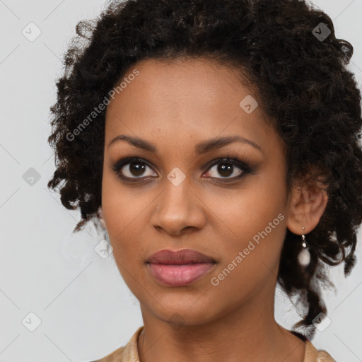 Joyful black young-adult female with long  brown hair and brown eyes