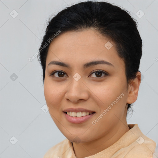 Joyful latino young-adult female with short  brown hair and brown eyes