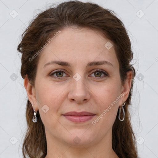 Joyful white young-adult female with long  brown hair and green eyes