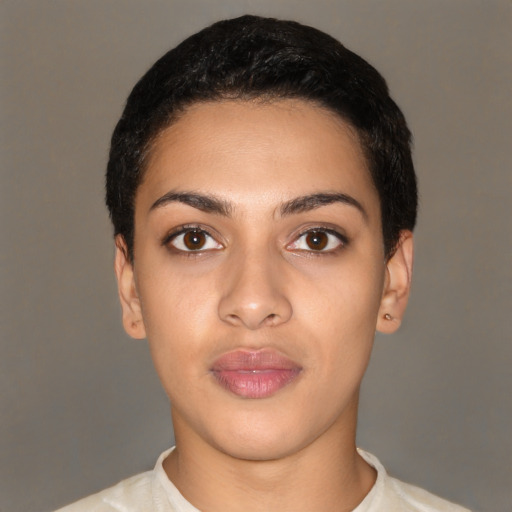 Joyful latino young-adult female with short  black hair and brown eyes