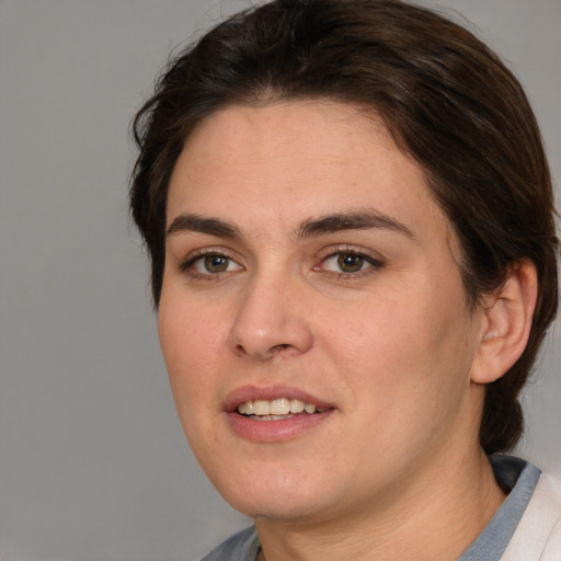 Joyful white young-adult female with medium  brown hair and brown eyes