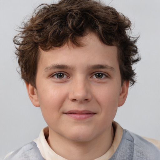 Joyful white child male with short  brown hair and brown eyes