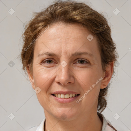 Joyful white adult female with short  brown hair and brown eyes