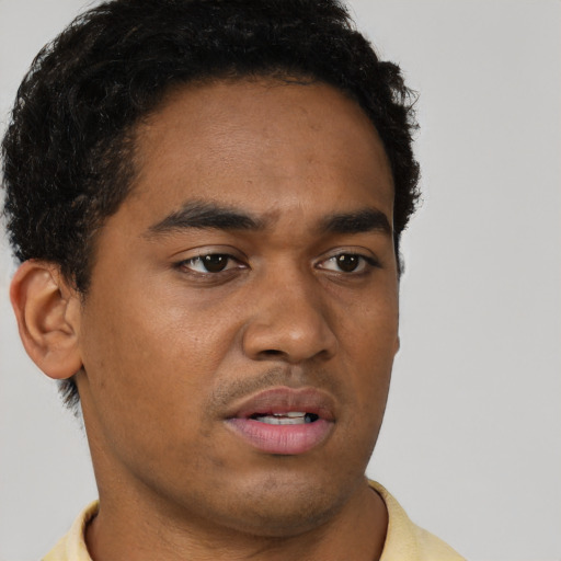 Neutral latino young-adult male with short  brown hair and brown eyes