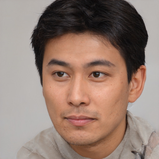 Neutral asian young-adult male with short  brown hair and brown eyes
