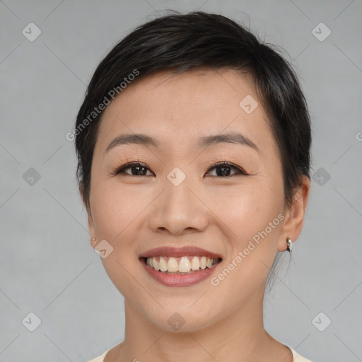 Joyful asian young-adult female with short  brown hair and brown eyes