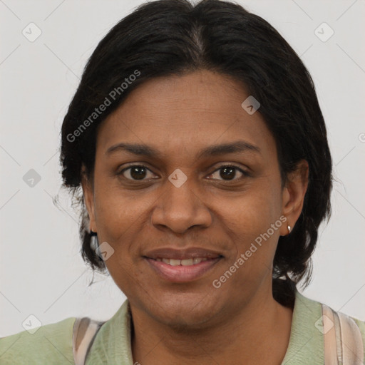 Joyful black adult female with short  brown hair and brown eyes