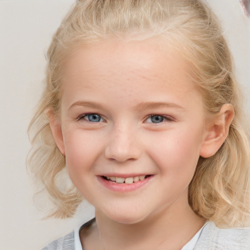 Joyful white child female with medium  blond hair and blue eyes