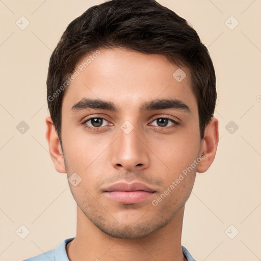 Neutral white young-adult male with short  brown hair and brown eyes