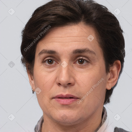 Joyful white adult female with short  brown hair and brown eyes