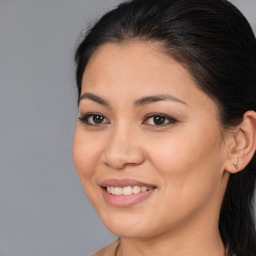 Joyful asian young-adult female with long  brown hair and brown eyes