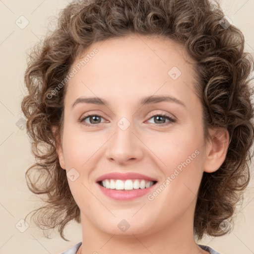 Joyful white young-adult female with medium  brown hair and green eyes