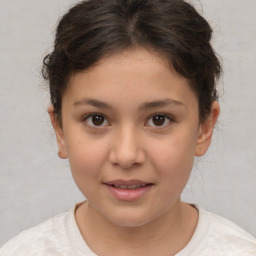 Joyful white child female with short  brown hair and brown eyes