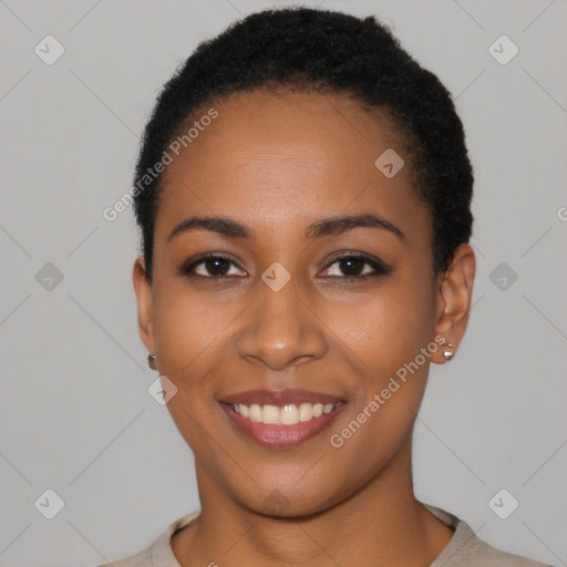 Joyful latino young-adult female with short  black hair and brown eyes