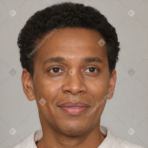 Joyful black adult male with short  black hair and brown eyes