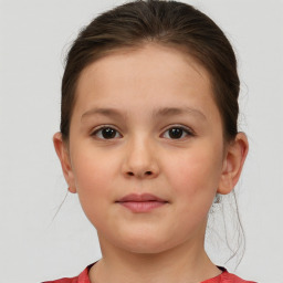 Joyful white child female with short  brown hair and brown eyes