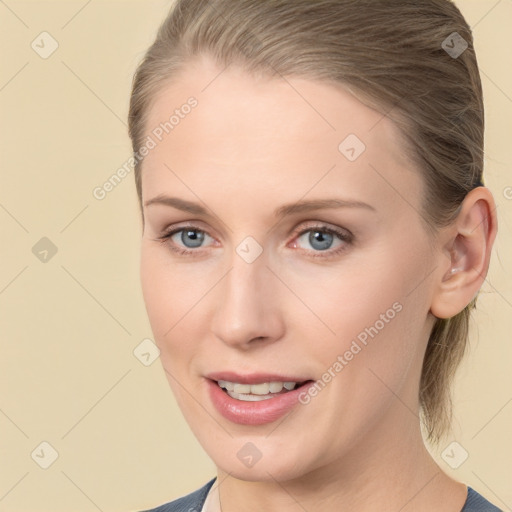 Joyful white young-adult female with medium  brown hair and blue eyes