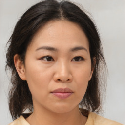 Neutral asian young-adult female with medium  brown hair and brown eyes