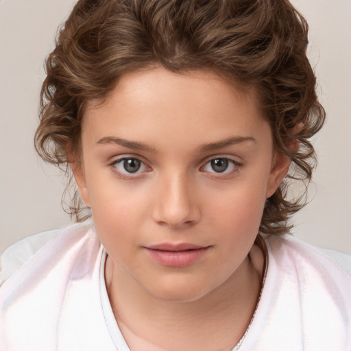 Joyful white child female with medium  brown hair and brown eyes